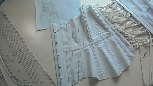 A corset toile in white coutil