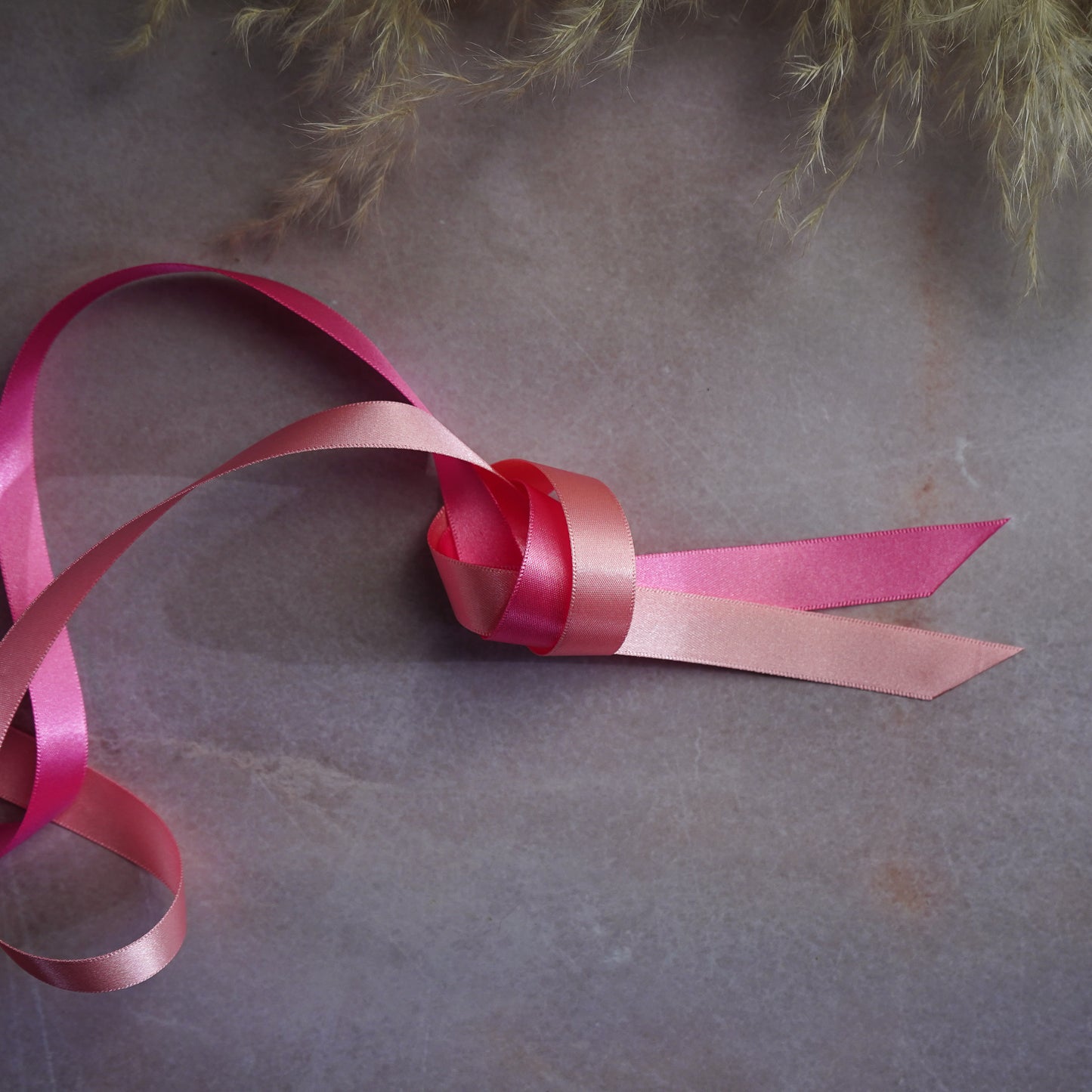Bright pink and baby pink ribbons for corset lacing
