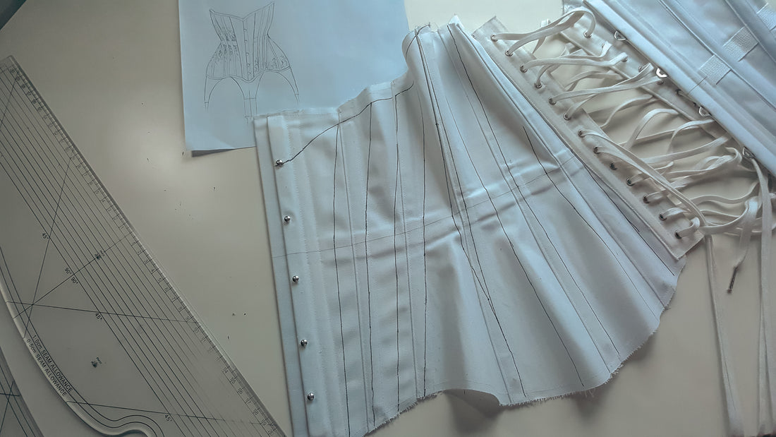 A corset toile in white coutil