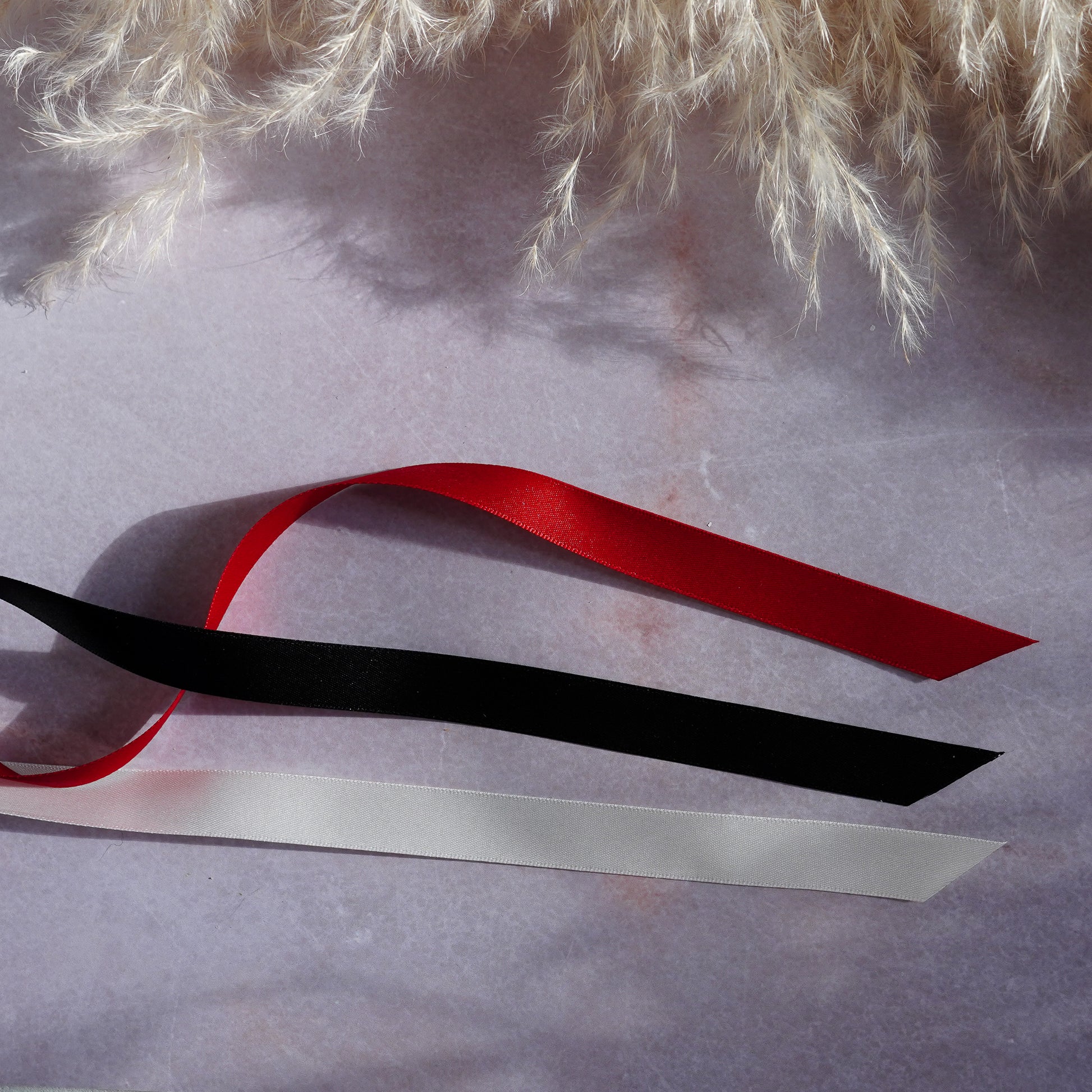 Black, red and ivory satin ribbons