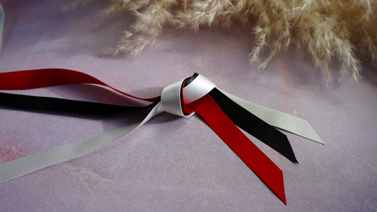 Black, red and ivory satin ribbons
