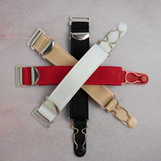 A grouping of hook on suspenders in white, black, red and beige.
