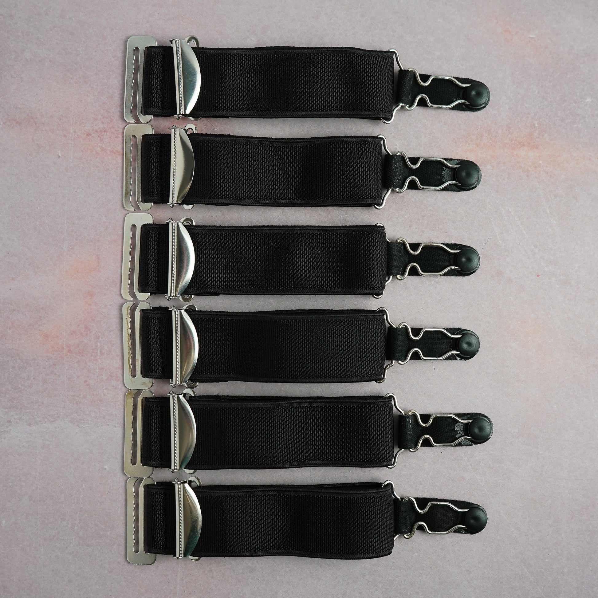 A set of 6 extra wide black suspenders with hooks