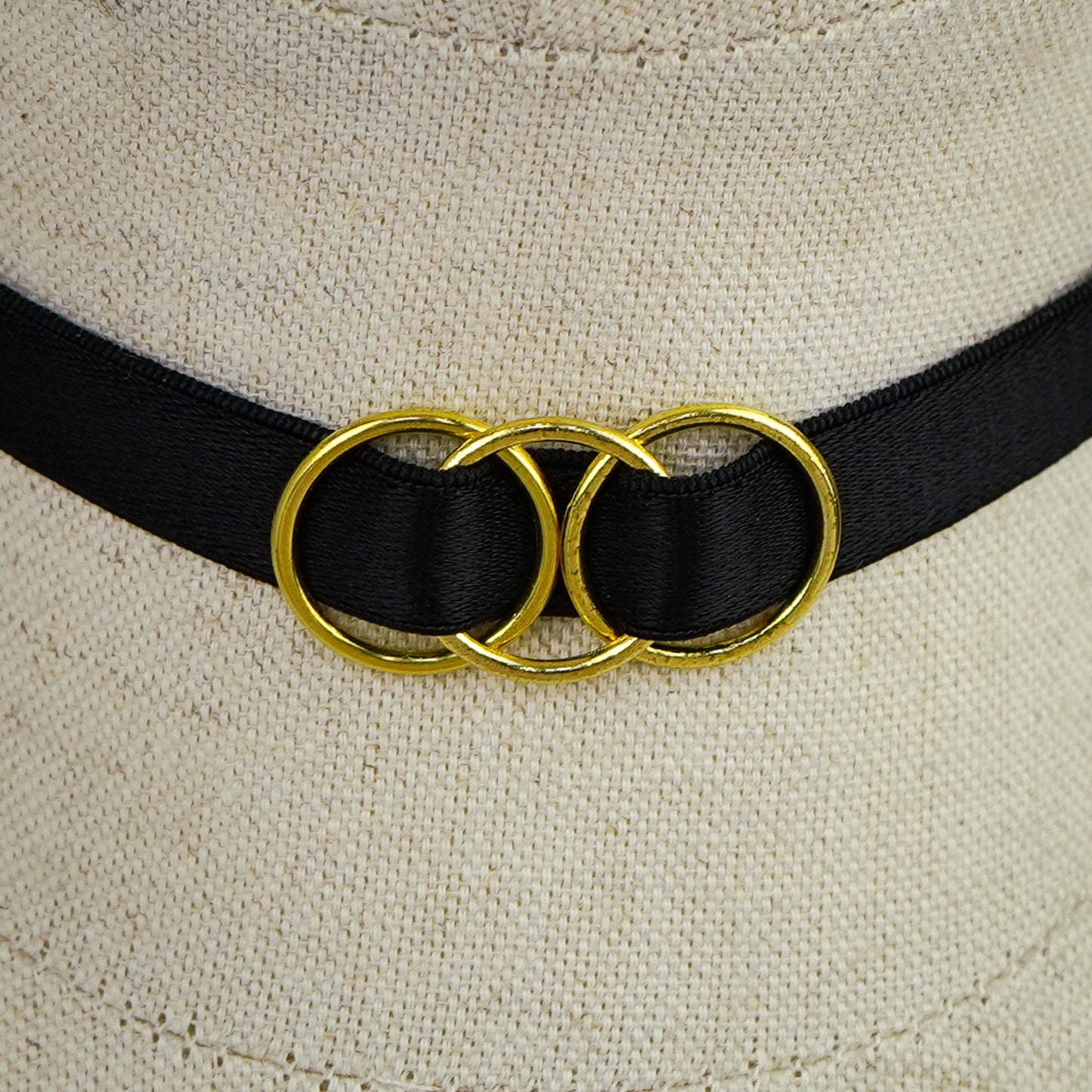 Telyn choker with gold triple interlocking rings in close up